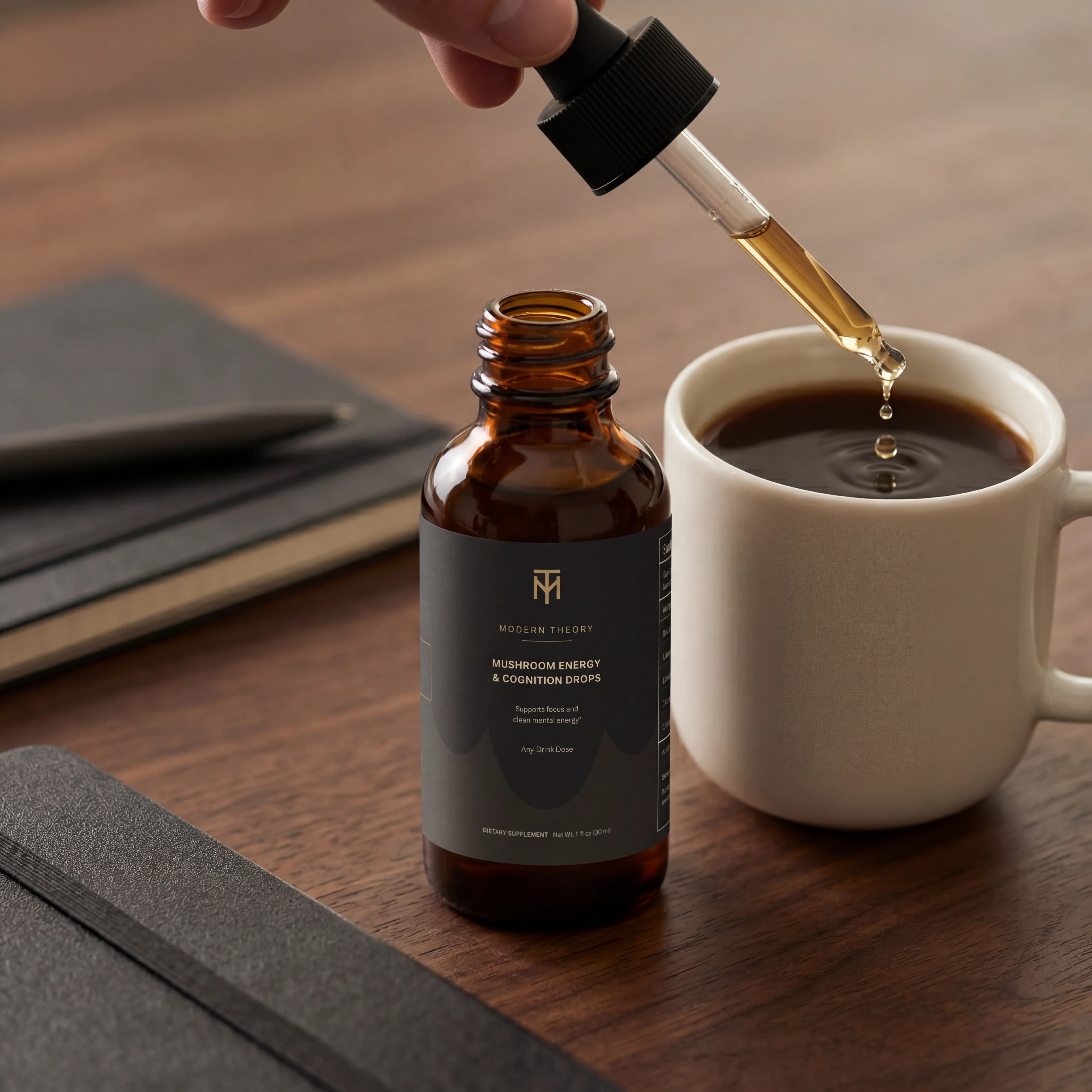 Modern Theory dropper dosing into a coffee beside the bottle