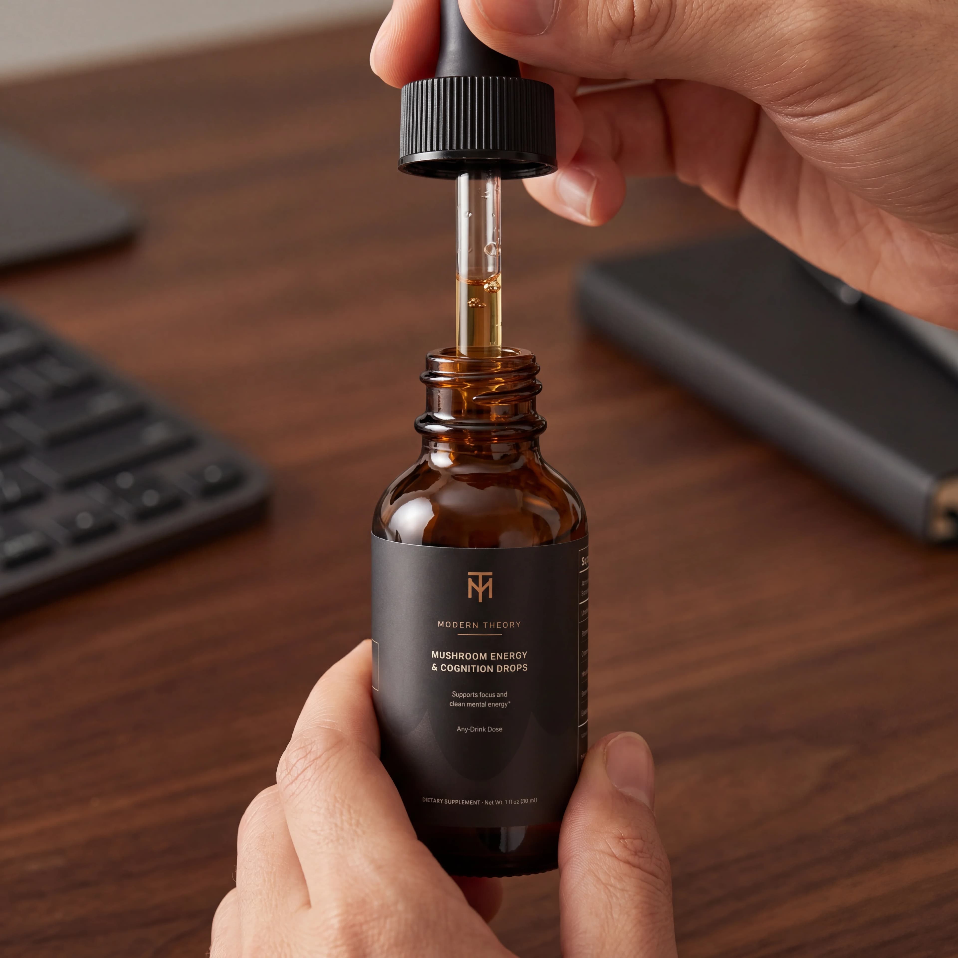 Modern Theory dropper and bottle on a focused work desk